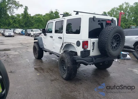 2014 Jeep Wrangler Unlimited Rubicon из США, поврежденный, VIN 1C4HJWFG4EL104827